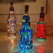 Mosaik lyktor och ljusflaskor