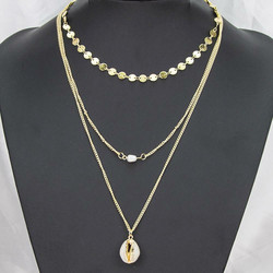 Kerroskaulakoru, FRENCH RIVIERA|Seashell Necklace in Gold with Pearl