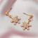 Joulukorvakorut, Festive Snowflake Earrings in Gold