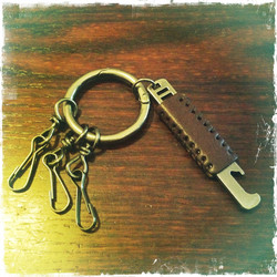 Leather key fob with metal decoration bottle opener