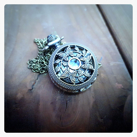 Small battery pocket watch with decor