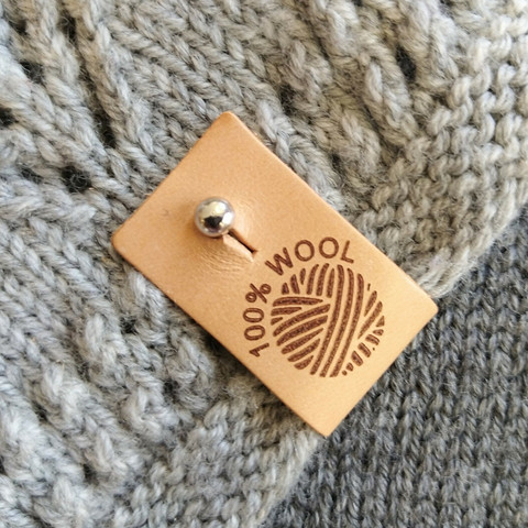 Lädermärke '100 % WOOL' (garnnystan)