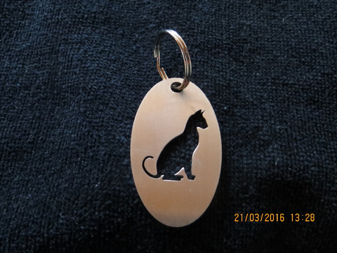 Keychain oval cat sitting short-haired