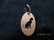 Keychain oval cat sitting short-haired