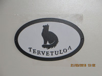 Welcome signboard cat sitting long-haired