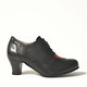 943325 VINTRO LEMPI, black shoe with a red heard