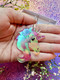 Hologrammiset Fantasy Unicorn -korvakorut renkailla