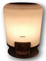 Kirkasvalolamppu kellolla ja ajastimella (Philips HF3463)