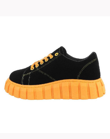 Black sneakers with shocking yellow bottom