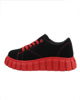 Black sneakers with shocking red bottom