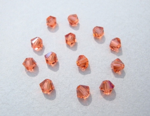 Swarovski kristallihelmi punainen (Padparadscha) AB bicone 4 mm (5/pss)