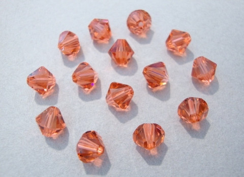 Swarovski kristallihelmi punainen (Padparadscha) bicone 6 mm (4/pss)
