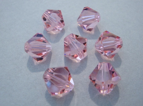 Swarovski kristallihelmi vaalean punainen bicone 10 mm (4/pss)