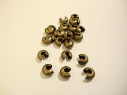 Pronssinvärinen suojahelmi/päällyshelmi 2 mm  kiinnityshelmelle (25 kpl/pss)