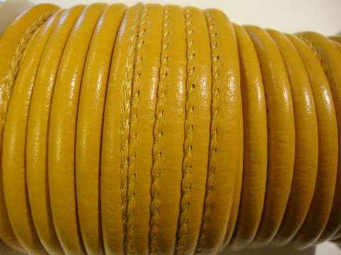 Nappajäljitelmänauha keltainen/okranvärinen pyöreä 4 mm (m-erä 50 cm)