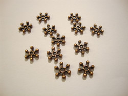 Välihelmi litteä rondelli Lumihiutale kupari 7,7 mm (n.46/pss)
