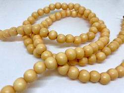 Puuhelmi lämpimän keltainen pyöreä 8 mm (n. 50 kpl/nauha)