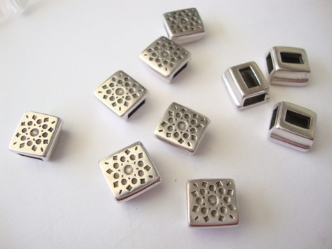 Metallihelmi/hela (slider) Auringonpilkut 9 x 9 mm 5 mm nahkanauhalle