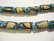 Lamppuhelmi turkoosi / beige tynnyri 18 x 11 mm (2/pss)