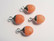 Kivihelmiriipus oranssi-hopea ovaali 14 x 8 mm