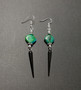 Black spike earrings with green stone beads