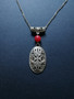 Medieval necklace with a red stone