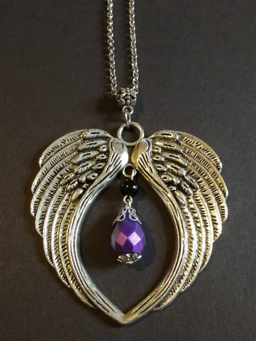 Silver colour wings necklace with violet drop