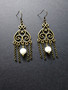 Hanging earrings with white stone beads