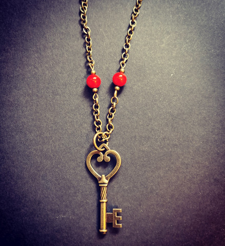 Key necklace with red beads