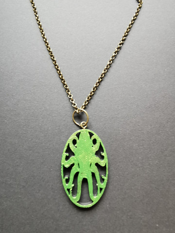 Green octopus necklace with bronze