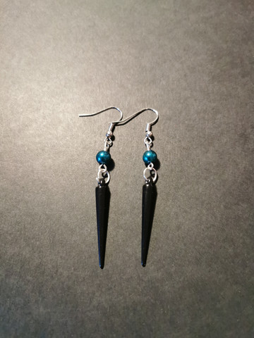 Black coloured spike earrings with turquoise beads 
