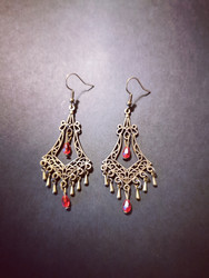 Hanging drop earrings with red beads