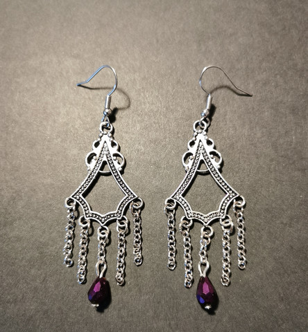 Hanging Earrings with chains and violet droplets.