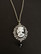 Black and white skeleton necklace