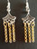 Silver colored and gold colored hanging earrings