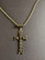 Cross with skulls necklace