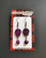 Violet golored skull earrings