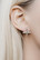 The Cross stud earrings by Sini Kolari