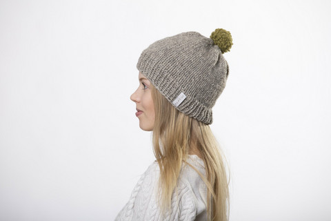 Beanie with green pom pom
