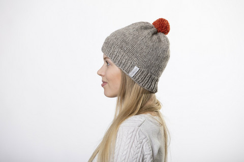 beanie with red pom pom