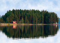 Red cottage by the lake