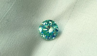 Moissaniitti / moissanite 0,8ct / 6,2mm  harvinaisempi sinertävän  vihreä sävy