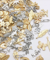 Erilaisia metallisia ripustin koruja 100 kpl 0,10€ kpl!!!!!