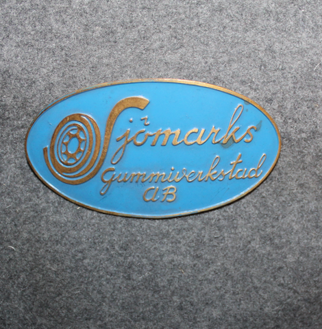 Sjömarks Gummiverkstad Ab. Tire shop, mechanics cap badge.